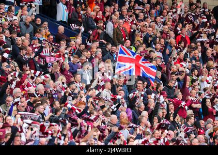 Heart of Midlothian football club supporters, waving a union flag, on the terracing at Hampden Park, Glasgow during the scottish cup semi final agains Stock Photo