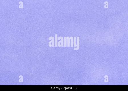Very peri matte background of suede fabric, macro. Velvet texture of seamless pastel leather. Texture of textile light blue backdrop, macro. Stock Photo