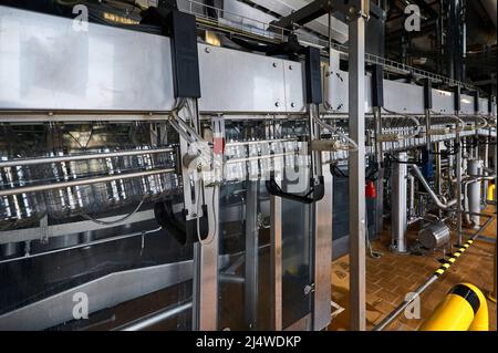 Production line with equipment of PET bottles blowing out Stock Photo