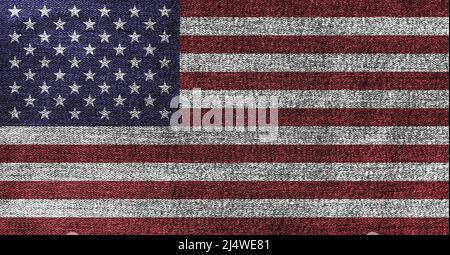 Grunge American flag on denim jeans textured abstract background concept. The National USA flag on denim frabric texture. Stock Photo