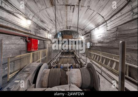 Belt conveyor system in an underground tunnel. Transportation of ore to the surface Stock Photo