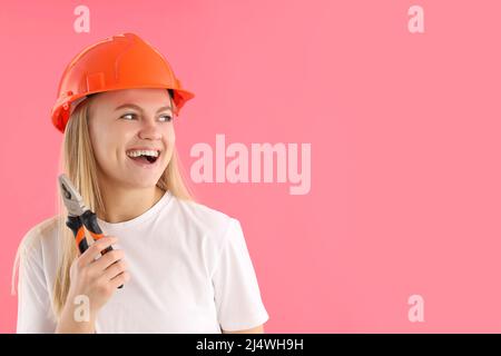 Concept of professions, young woman on pink background Stock Photo