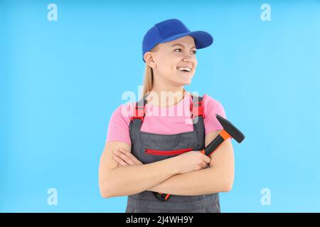 Concept of occupation, young woman on blue background Stock Photo