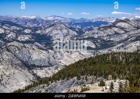 Tenaya Lake nestles in the Sierra Nevada Mountains, from Clouds Rest, in Yosemite National Park, near Merced, California. Stock Photo