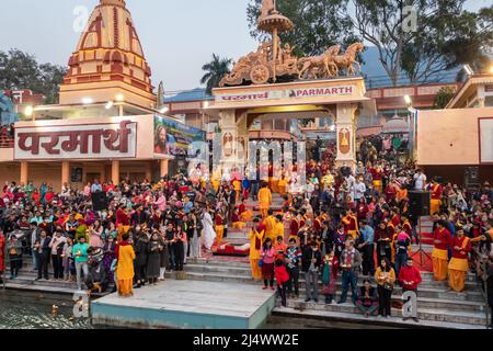 hindu temple filled with crowed at evening form religious prayer image is taken at parmarth niketan rishikesh uttrakhand india on Mar 15 2022. Stock Photo