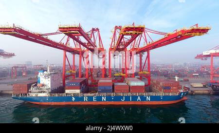 Beijing, China. 26th Jan, 2022. Aerial photo taken on Jan. 26, 2022 shows a cargo vessel at Rizhao Port in east China's Shandong Province. Credit: Guo Xulei/Xinhua/Alamy Live News Stock Photo