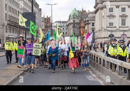Extinction Rebellion protest on Waterloo Bridge against the use of fossil fuels and to raise awareness of climate change. London - 15th April 2022 Stock Photo