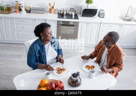 high angle view of happy and senior african american couple having breakfast Stock Photo