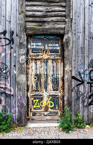 Weathered & Graffiti covered wooden door and fence in Holzmarktstrasse,Berlin,Germany Stock Photo