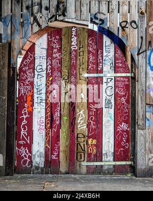 Graffiti covered wooden door and fence in Holzmarktstrasse,Berlin,Germany Stock Photo