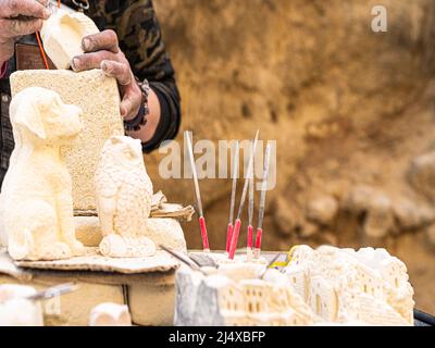 woman hand working on piece of stone Stock Photo