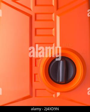 black knob plastic rotary toggle on off switch with orange background, operating electric machinery concept with copy space Stock Photo