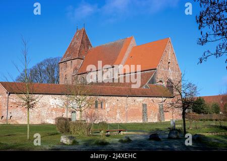 Historic monastery church from Rehna in red brick architecture against the blue sky, seen from east, Mecklenburg-Western Pomerania, Germany Stock Photo
