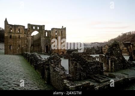 View from Galilee Porch along the Nave to the Presbytery with North & South Transepts of ruined Rievaulx Cistercian Abbey - daybreak