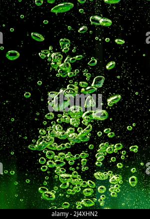 Air bubbles green on a black background Stock Photo