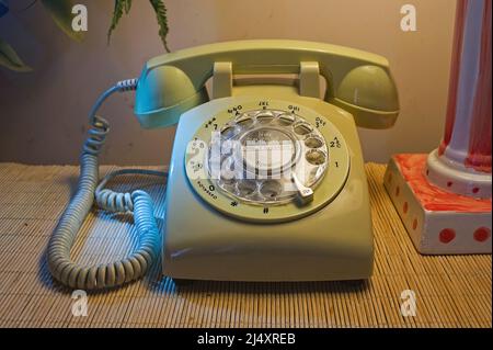 Retro-style rotary dial telephone in the home Stock Photo