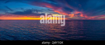 Beautiful sunset over the water surface Stock Photo
