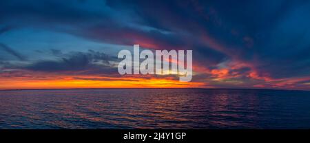 Beautiful sunset over the water surface Stock Photo