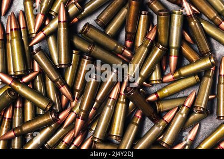 Bullets background texture. Cartridges 7.62 caliber for Kalashnikov assault rifle. Top view, flat lay Stock Photo