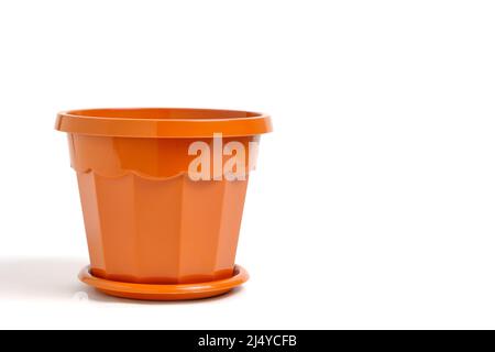 Brown, plastic, empty flower pot on a white background Stock Photo