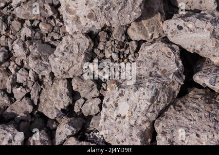 Background of hardened stones made of concrete Stock Photo