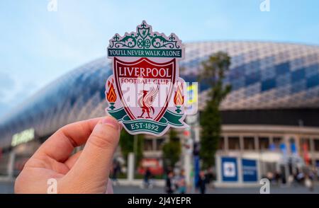 September 12, 2021, Liverpool, UK. Liverpool F.C. Football Club emblem against the backdrop of a modern stadium. Stock Photo