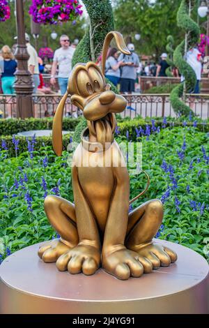 Pluto Gold Statue 50th Anniversary Disney Magic Kingdom Stock Photo