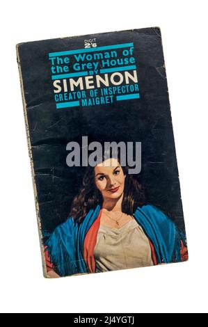 An old battered paperback copy of The Woman of the Grey House by Georges Simenon.  First published in 1933. Stock Photo