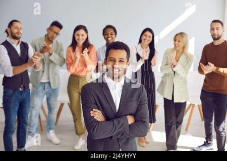 Portrait of young african american businessman who is looking at camera with confident expression. Stock Photo