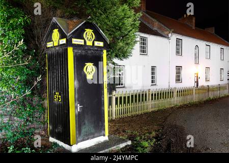 A preserved Automobile Association phone box. This one is number 573 and is located at the bottom of Garrowby Hill in the East Riding of Yorkshire Stock Photo