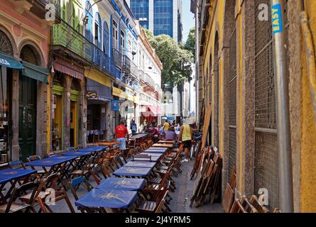 RIO DE JANEIRO, BRAZIL - APRIL 15, 2017: The famous Ouvidor Street (Rua do Ouvidor) and the preparation of tables to serve customers Stock Photo