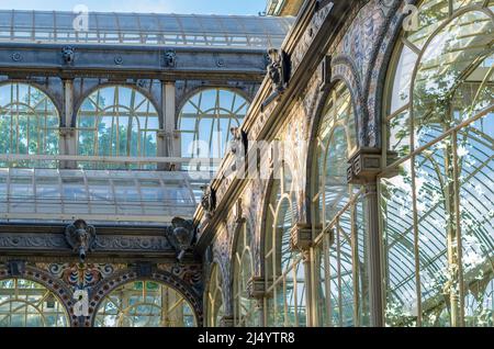 MADRID, SPAIN - MAY 30, 2021: Detail of the Palacio de Cristal ('Glass Palace'), a metal and glass structure located in the Retiro Park in Madrid, Spa