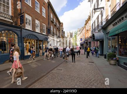 People shopping on Trinity Street, Cambridge city centre, Cambridge UK Stock Photo