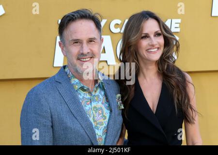 LOS ANGELES - APR 14:  David Arquette, Christina McLarty at the They Call Me Magic Premiere Screening at Village Theater on April 14, 2022  in Westwood, CA Stock Photo