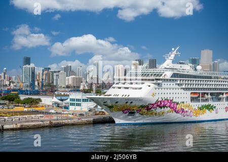 Norwegian Cruise Line’s Norwegian Sky, docked at the Port of Miami with the Miami skyline in the background. Stock Photo