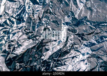 Reflective crumpled foil texture background Stock Photo
