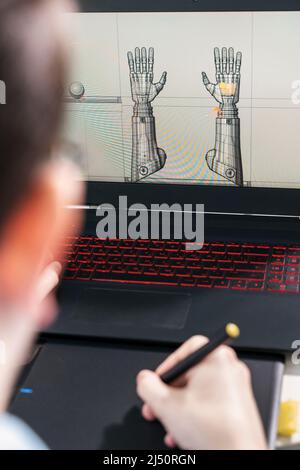digital artist working on 3d graphics using a graphics tablet. Stock Photo