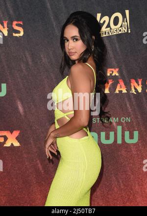 Emily Tosta walking on the red carpet at FX's "Mayans M.C." season 4