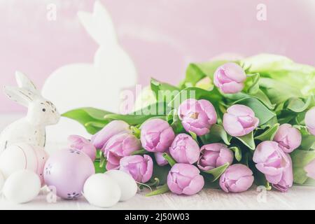 Bunch of fresh pink tulips with Easter decorations, pink, green and white colors Stock Photo