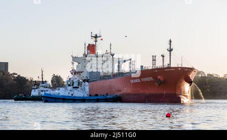 Cork Harbour, Cork, Ireland. 19th April, 2022. Tanker Grande Riviere with a cargo of Methanol is assisted by tug boats Gerry O' Sullivan and Alex to make a turing manoeuvre at the Belvelly Port Facility, Cork, Ireland. - Credit; David Creedon / Alamy Live News Stock Photo