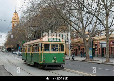 The City Circle tram on a cold Winters day in Melbourne Central. The tower of Flinders Street station just visible in background Stock Photo