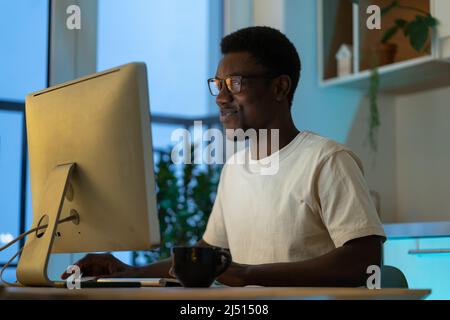 Thoughtful web developer work on computer, programmer trying to find solution for bug in app code Stock Photo