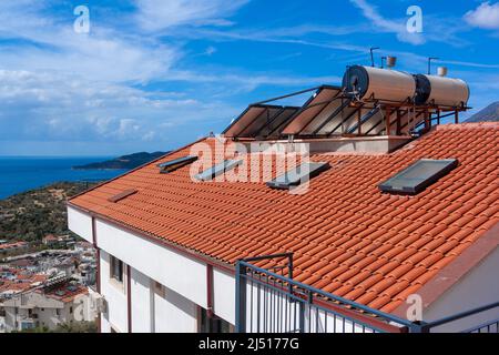 Solar water heater installed on a roof Stock Photo - Alamy