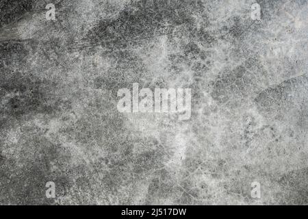 background textures concrete gray dark cracks and spots with blots. the dark side turns into the light side, the smooth wall is covered. Stock Photo