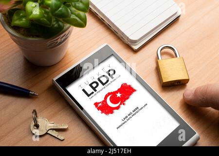 Lpdp (turkish law on personal data protection) concept: smartphone with an imaginary page showing a Turkey map and text about the turkish law no. 6698 Stock Photo
