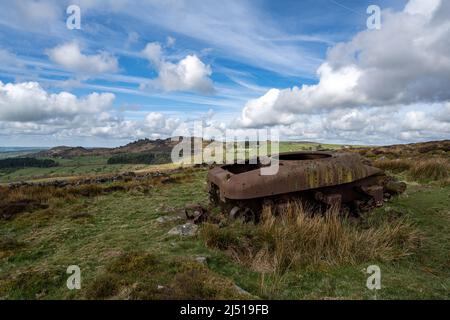 Abandoned Sherman tank in the Peak District National Park at The Roaches, Upper Hulme with Ramshaw Rocks in the distance. Stock Photo