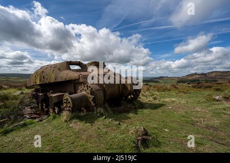 Abandoned Sherman tank in the Peak District National Park at The Roaches, Upper Hulme with Ramshaw Rocks in the distance. Stock Photo