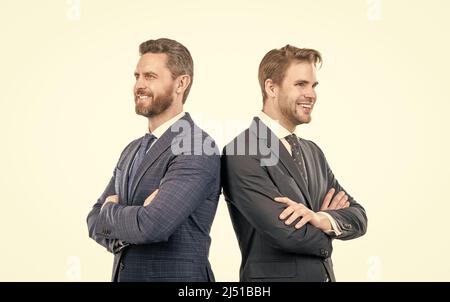 two happy business colleagues in suit cross hands isolated on white, business Stock Photo