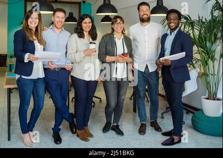 Happy diverse team in office Stock Photo