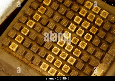 old cash register keyboard - abandoned and dirty typewriter Stock Photo